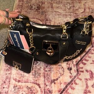 Juicy Couture Black and Gold Shoulder Bag with Glossy Finish